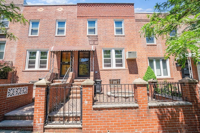 2010 27th St, Astoria, NY 11105 - view of property with a fenced front yard and brick siding