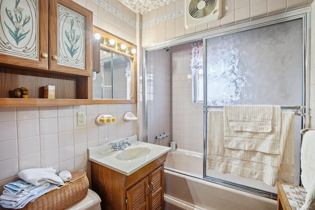 2010 27th St, Astoria, NY 11105 - full bath featuring vanity, combined bath / shower with glass door, tile walls, and toilet