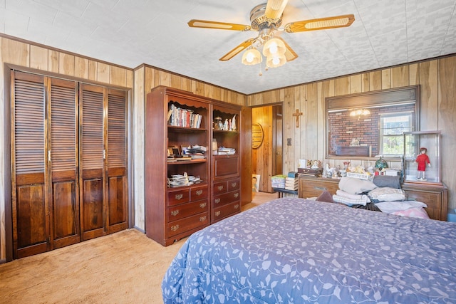 2010 27th St, Astoria, NY 11105 - bedroom with carpet floors, wooden walls, crown molding, and a ceiling fan