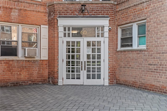 60 Locust Ave Unit 610, New Rochelle, NY 10801 - property entrance featuring brick siding, french doors, and a patio area