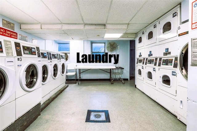 60 Locust Ave Unit 610, New Rochelle, NY 10801 - communal laundry room featuring independent washer and dryer, tile patterned floors, and stacked washing machine and dryer