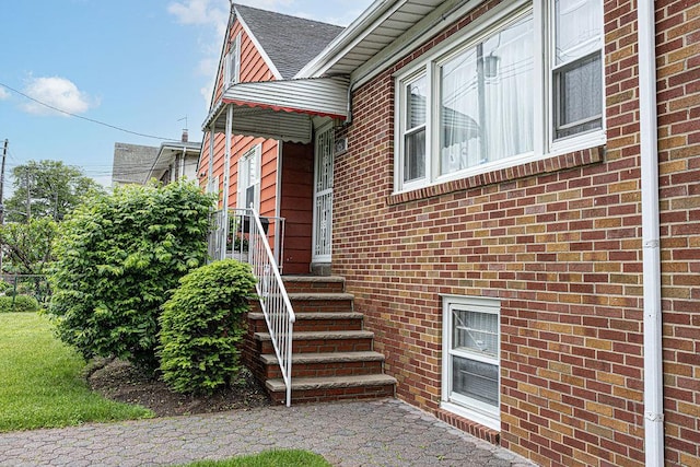 426 N High St, Mount Vernon, NY 10552 - entrance to property featuring brick siding and roof with shingles