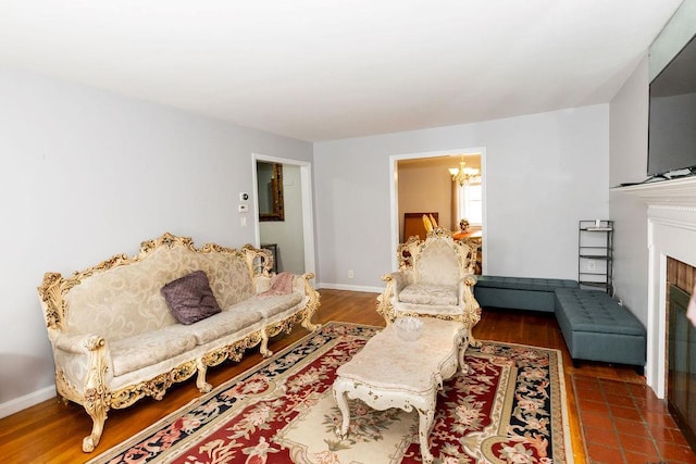426 N High St, Mount Vernon, NY 10552 - living room with a chandelier, a fireplace with flush hearth, and baseboards