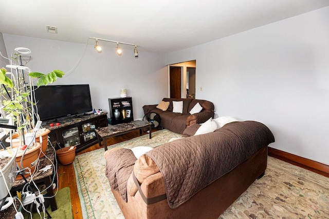 426 N High St, Mount Vernon, NY 10552 - living room featuring wood finished floors and rail lighting