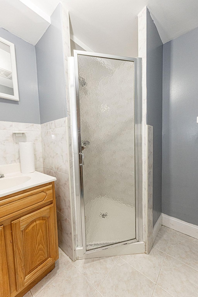 426 N High St, Mount Vernon, NY 10552 - bathroom featuring tile patterned flooring, vanity, a shower stall, and tile walls