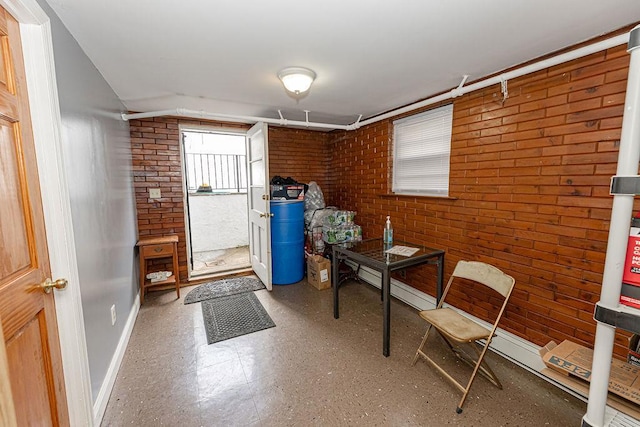 426 N High St, Mount Vernon, NY 10552 - office space with brick wall, baseboards, and tile patterned floors