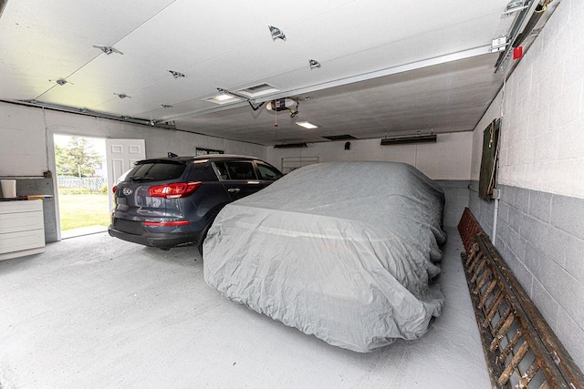 426 N High St, Mount Vernon, NY 10552 - garage featuring a garage door opener and concrete block wall