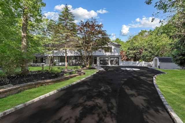 38 Cottontail Rd, Melville, NY 11747 - view of front of home featuring a garage and driveway