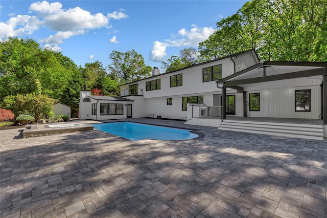 38 Cottontail Rd, Melville, NY 11747 - view of pool with a patio, an outdoor structure, and a pool with connected hot tub