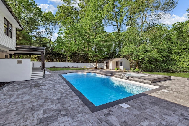 38 Cottontail Rd, Melville, NY 11747 - view of pool featuring a patio area, a jacuzzi, a fenced backyard, and view of wooded area
