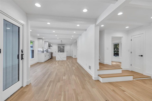 38 Cottontail Rd, Melville, NY 11747 - hall featuring light wood-style floors, plenty of natural light, beam ceiling, recessed lighting, and baseboards