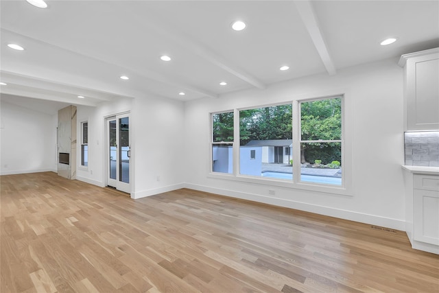 38 Cottontail Rd, Melville, NY 11747 - unfurnished living room featuring beamed ceiling, light wood finished floors, baseboards, and recessed lighting