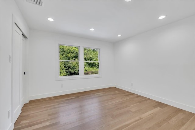 38 Cottontail Rd, Melville, NY 11747 - unfurnished bedroom with light wood finished floors, recessed lighting, baseboards, and a closet