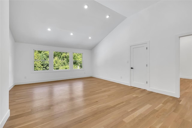 38 Cottontail Rd, Melville, NY 11747 - empty room with baseboards, light wood-style floors, high vaulted ceiling, and recessed lighting