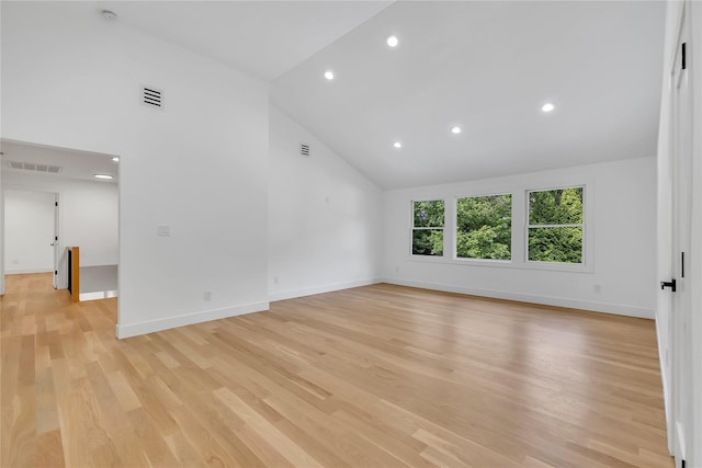38 Cottontail Rd, Melville, NY 11747 - empty room with high vaulted ceiling, baseboards, recessed lighting, light wood-type flooring, and a smoke detector