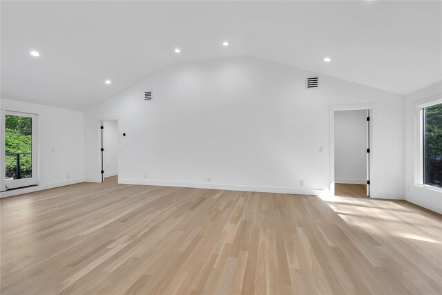 38 Cottontail Rd, Melville, NY 11747 - unfurnished living room with vaulted ceiling, recessed lighting, light wood-style flooring, and baseboards