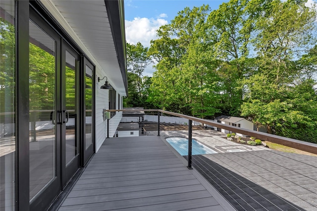 38 Cottontail Rd, Melville, NY 11747 - deck featuring a swimming pool and french doors