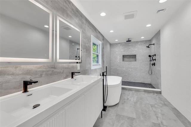 38 Cottontail Rd, Melville, NY 11747 - bathroom with a tile shower, double vanity, tile walls, marble finish flooring, and recessed lighting
