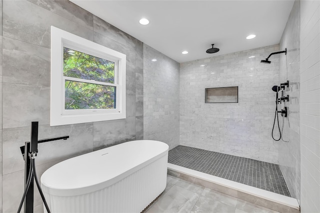 38 Cottontail Rd, Melville, NY 11747 - bathroom with a freestanding tub, a tile shower, tile walls, recessed lighting, and marble finish floors