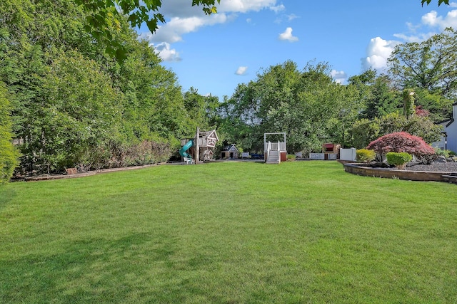 38 Cottontail Rd, Melville, NY 11747 - view of grassy yard featuring a playground