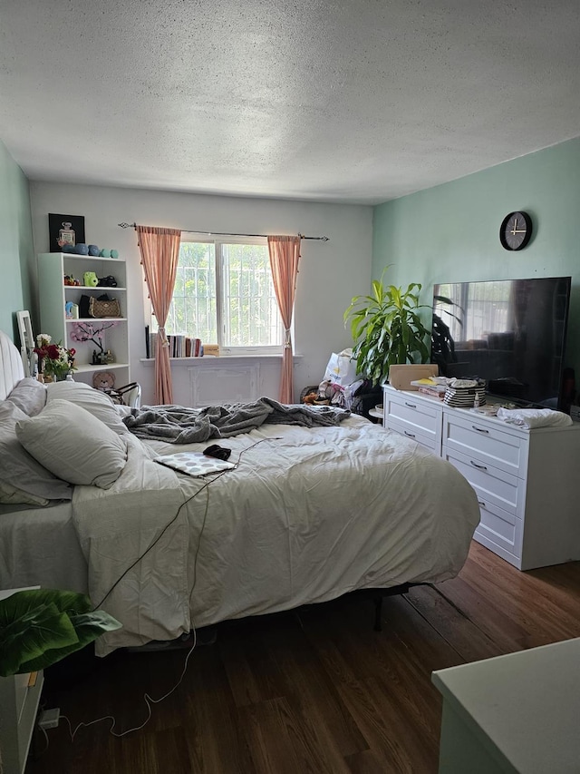 5824 Van Cleef St, Corona, NY 11368 - bedroom with dark wood-style floors and a textured ceiling
