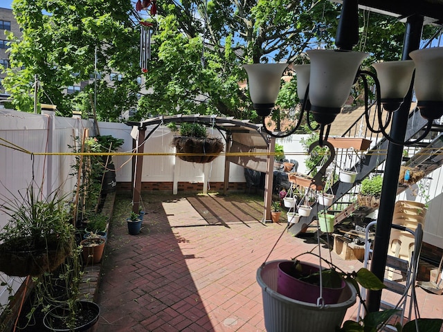 5824 Van Cleef St, Corona, NY 11368 - fenced backyard featuring a patio and stairway