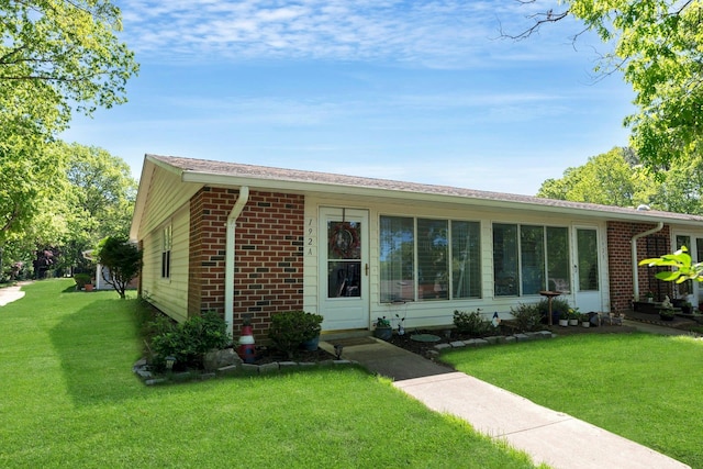 192 Ventry Ct Unit A, Ridge, NY 11961 - ranch-style house with brick siding and a front lawn