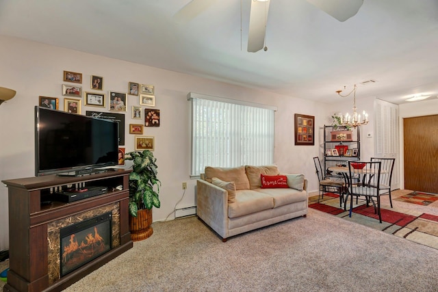 192 Ventry Ct Unit A, Ridge, NY 11961 - living area featuring carpet floors, a chandelier, a ceiling fan, a baseboard heating unit, and a glass covered fireplace