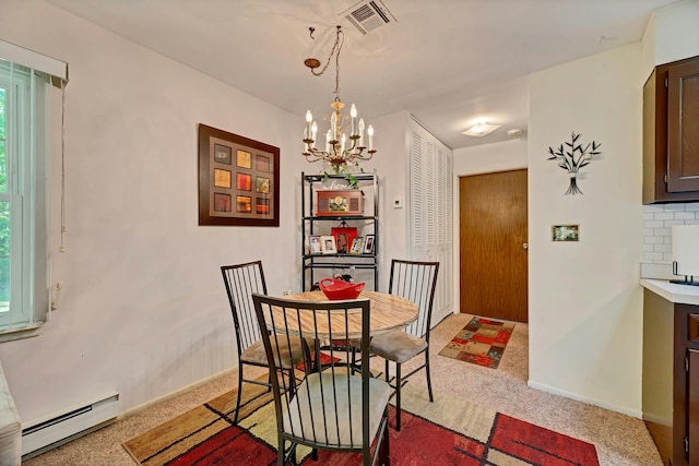192 Ventry Ct Unit A, Ridge, NY 11961 - dining space featuring a baseboard heating unit, a chandelier, plenty of natural light, and baseboards