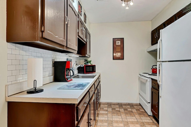 192 Ventry Ct Unit A, Ridge, NY 11961 - kitchen featuring white appliances, a sink, under cabinet range hood, decorative backsplash, and light countertops