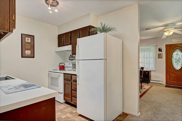 192 Ventry Ct Unit A, Ridge, NY 11961 - kitchen featuring white appliances, under cabinet range hood, a baseboard radiator, light countertops, and ceiling fan
