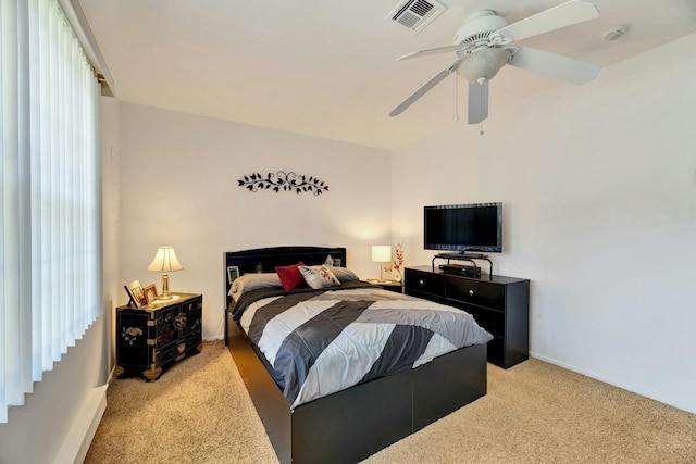 192 Ventry Ct Unit A, Ridge, NY 11961 - bedroom with light colored carpet, multiple windows, and a ceiling fan