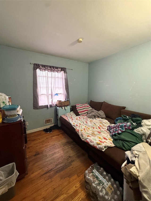 328 Brentwood Pkwy, Brentwood, NY 11717 - bedroom featuring wood finished floors, radiator, and baseboards