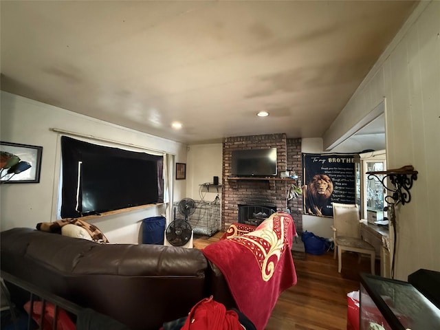 328 Brentwood Pkwy, Brentwood, NY 11717 - living room with wood finished floors, a brick fireplace, and recessed lighting