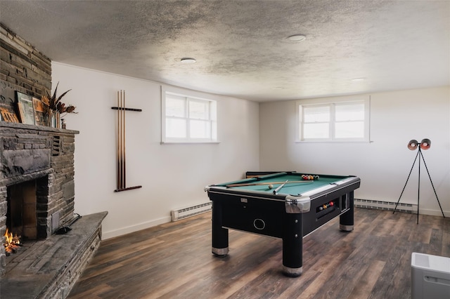 877 Shandelee Rd, Livingston Manor, NY 12758 - playroom with a fireplace, billiards table, a baseboard heating unit, a textured ceiling, and wood finished floors