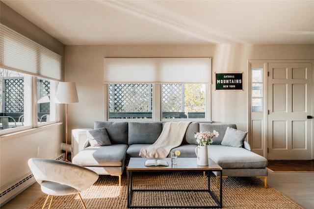 877 Shandelee Rd, Livingston Manor, NY 12758 - living area featuring a baseboard heating unit and wood finished floors