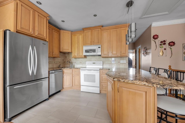 1627 Research Ave, Bronx, NY 10465 - kitchen featuring appliances with stainless steel finishes, backsplash, light stone countertops, a breakfast bar area, and a sink