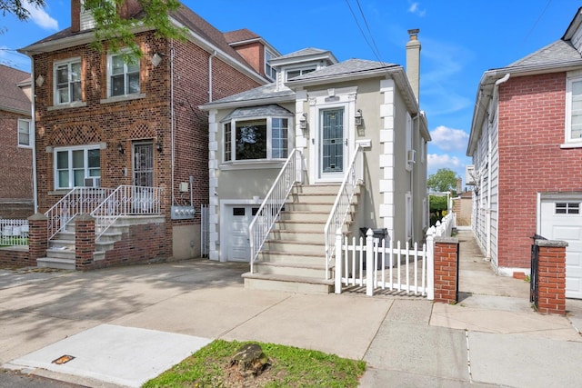 1627 Research Ave, Bronx, NY 10465 - view of front of property featuring concrete driveway, a garage, and brick siding