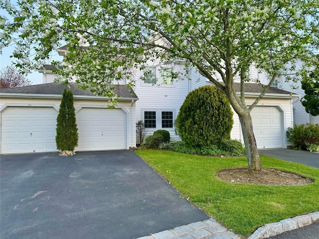 19 Erin Ln, East Setauket, NY 11733 - view of front of property featuring asphalt driveway, a front lawn, and a shingled roof