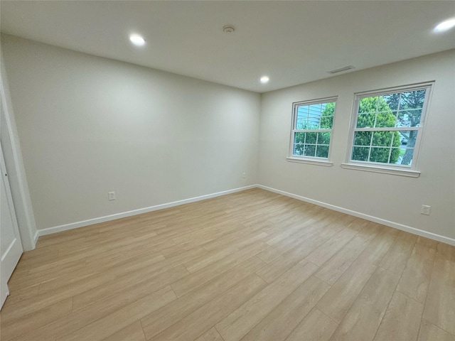 19 Erin Ln, East Setauket, NY 11733 - spare room with light wood-type flooring, baseboards, recessed lighting, and a smoke detector