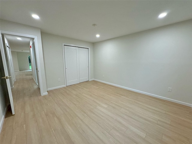 19 Erin Ln, East Setauket, NY 11733 - unfurnished bedroom featuring light wood finished floors, recessed lighting, baseboards, and a closet