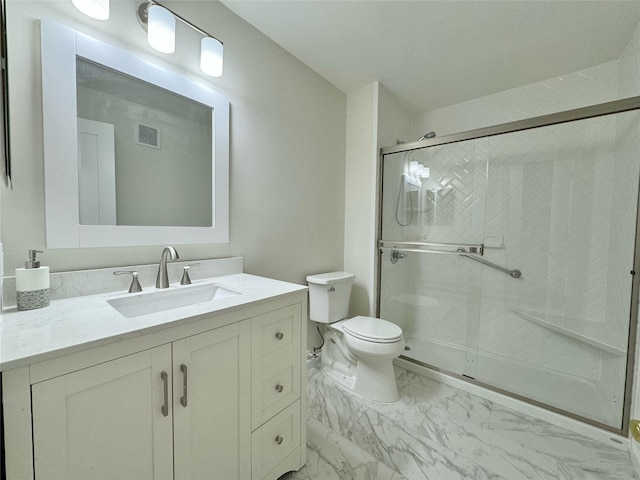 19 Erin Ln, East Setauket, NY 11733 - bathroom featuring marble finish flooring, a stall shower, vanity, and toilet