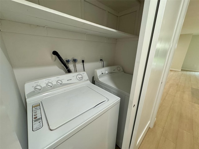19 Erin Ln, East Setauket, NY 11733 - laundry room featuring independent washer and dryer and light wood finished floors