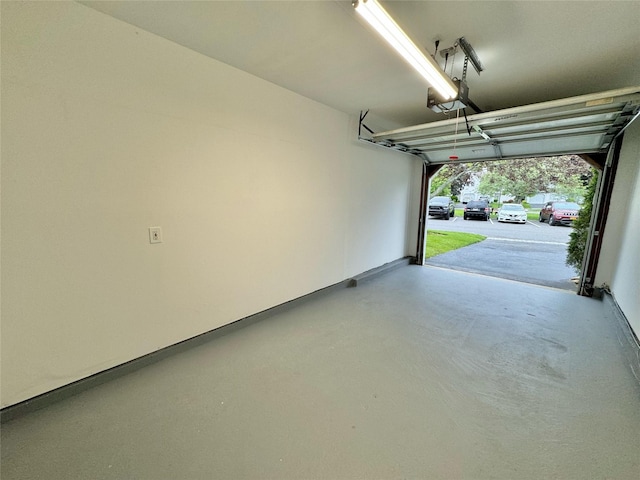 19 Erin Ln, East Setauket, NY 11733 - garage featuring a garage door opener
