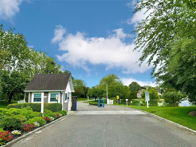 19 Erin Ln, East Setauket, NY 11733 - view of asphalt road with traffic signs and curbs