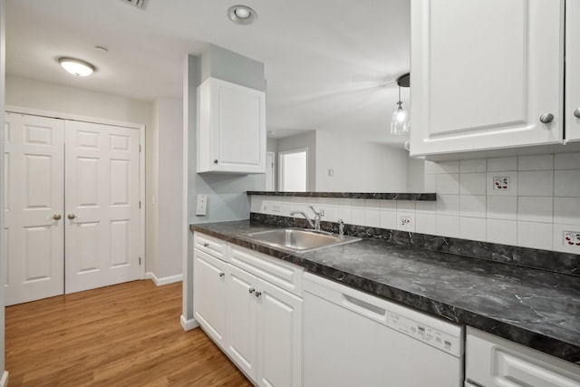200 Woodcrest Ln Unit 202, Mount Kisco, NY 10549 - kitchen featuring a sink, dishwasher, white cabinetry, dark countertops, and decorative backsplash