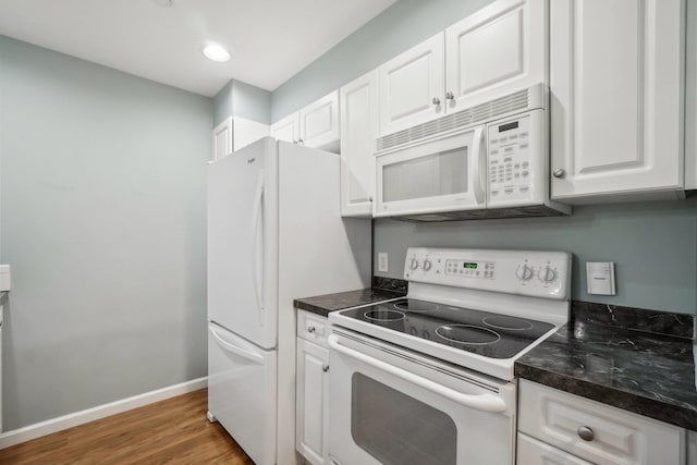 200 Woodcrest Ln Unit 202, Mount Kisco, NY 10549 - kitchen featuring white appliances, dark countertops, white cabinetry, baseboards, and recessed lighting