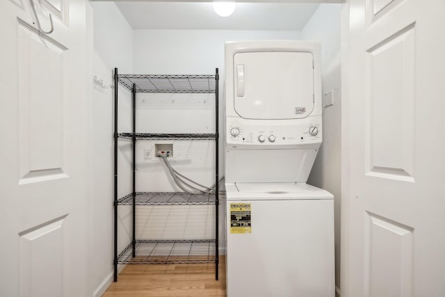 200 Woodcrest Ln Unit 202, Mount Kisco, NY 10549 - laundry room with stacked washer and clothes dryer and light wood finished floors