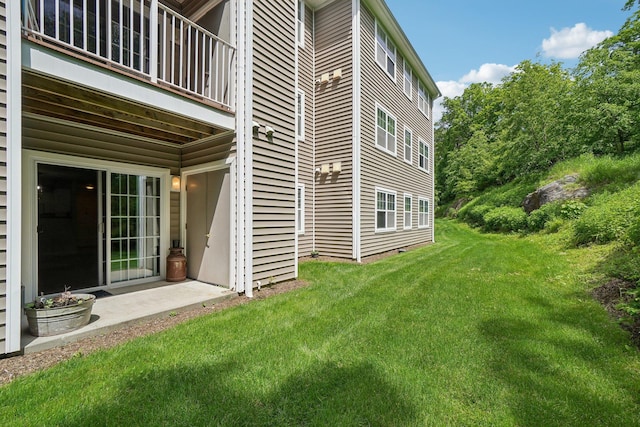 200 Woodcrest Ln Unit 202, Mount Kisco, NY 10549 - view of side of home featuring a lawn and a balcony