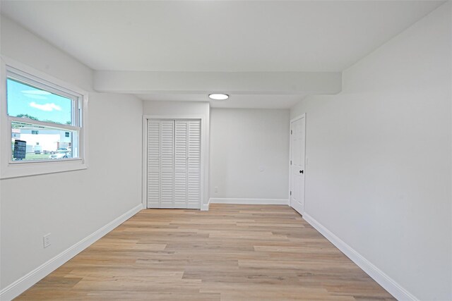 71 Cinnamon St, Central Islip, NY 11722 - unfurnished bedroom featuring light wood-style floors and baseboards